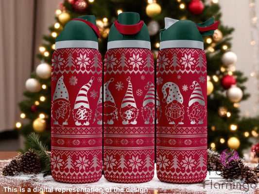 Three red thermos bottles with Christmas-themed designs in front of a decorated Christmas tree.