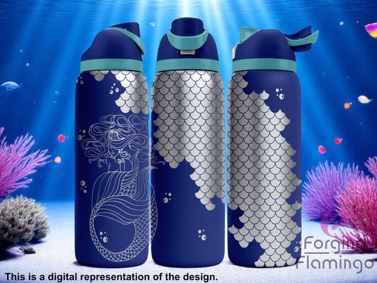 Three navy blue tumblers with flip-top lids, engraved with a mermaid design on one side and fish scale patterns wrapping around the rest of the tumbler, displayed against an underwater scene with coral, fish, and light rays. Text below reads “This is a digital representation of the design.”