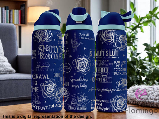 Three navy blue tumblers with flip-top lids, engraved with Smutty Book Club themed phrases, roses, skeleton hand, lips, stars, and playful text such as "Crawl to me," "Smut Slut," "Trigger Warnings," and "Fuck off I am reading," displayed on a cozy reading nook background with bookshelves and plants. Text below reads “This is a digital representation of the design.”