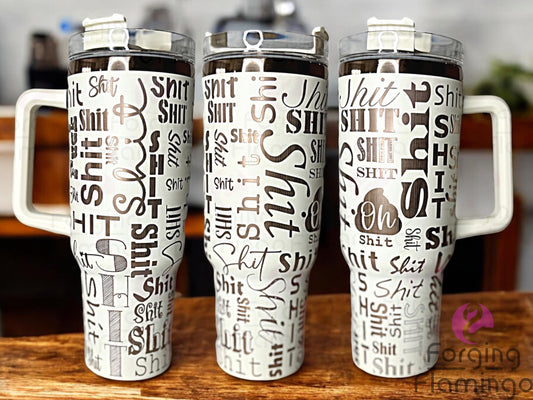 Composite image of a 40oz cream tumbler with gold engraving, featuring Forging Flamingo's Sh!t Cup design with one "F*ck" included in the mix. Displayed from multiple angles to showcase playful profanity and bold fonts in a seamless wrap. Part of our Bargain Bin collection.