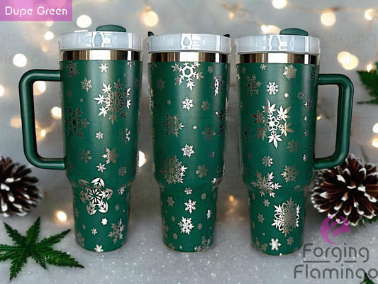 Composite image of a single Non-Branded green tumbler with a stainless base, engraved with Forging Flamingo's Cannabis Snowflakes design, shown from multiple angles to highlight snowflake patterns made from marijuana leaves in a seamless, festive wrap.