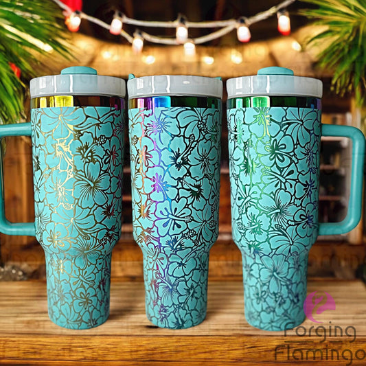 Composite image of a teal Stanley tumbler engraved with Forging Flamingo's Hibiscus Flowers design on a rainbow metal base, displayed from several angles to showcase the seamless tropical wrap featuring vivid hibiscus blooms and leaves.