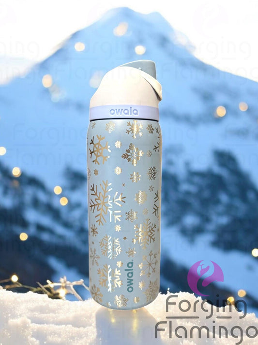 Single image of a single Owala sea salt tumbler engraved with Forging Flamingo's Snowflakes design, showcasing wintery snowflakes in a seamless festive wrap.