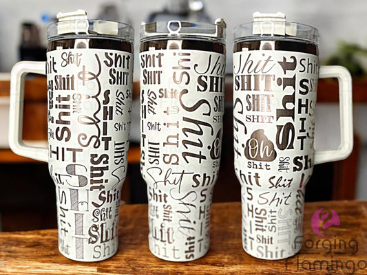 Composite image of a single Non-Branded tumbler engraved with Forging Flamingo's Sh!t Cup design in cream and gold, shown from multiple angles to highlight playful, bold typography in a seamless wrap.