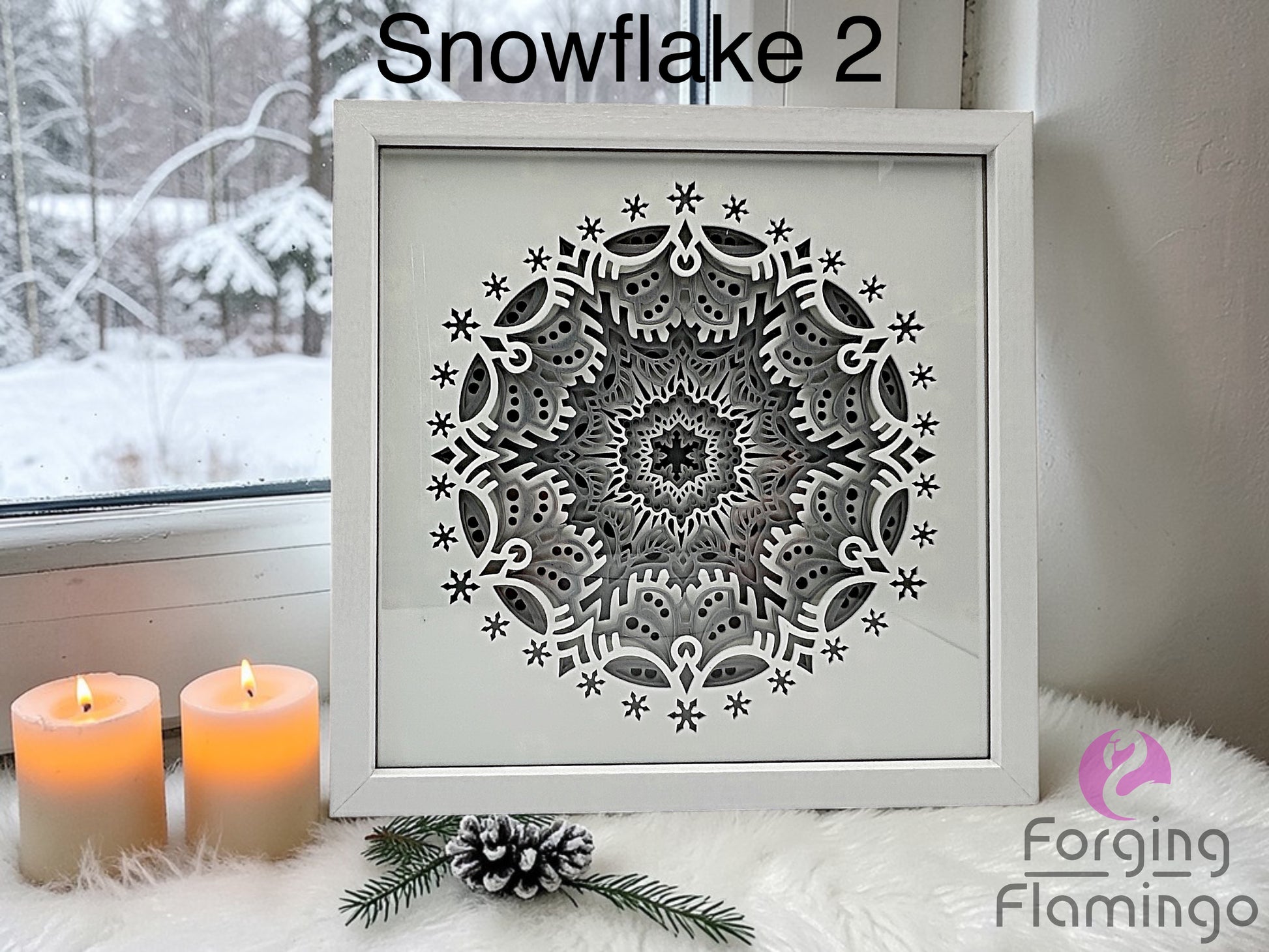 Decorative snowflake design in a frame with candles and winter scenery