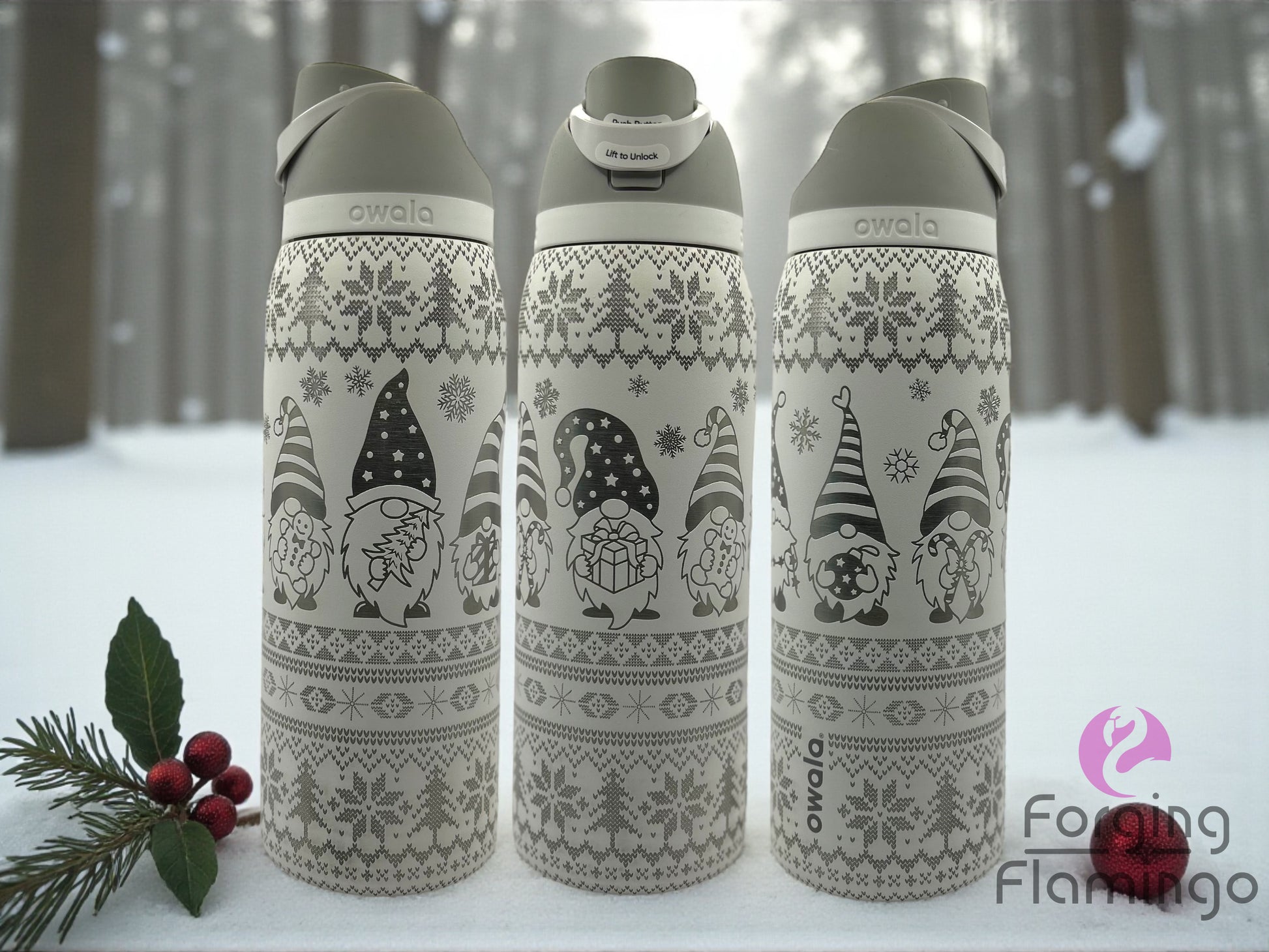 Three insulated bottles with gnome design in a snowy forest setting