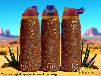 Three brown Owala tumblers with red and purple lids, engraved with swirling desert-inspired lines and five stylized geckos crawling in different directions. The geckos are dotted and intricately patterned, with wide-spread toes. Each tumbler displays a different section of the seamless wrap. The background is a warm desert landscape with blue sky, red rock formations, and tall green cacti. Forging Flamingo logo is visible in the lower right corner.
