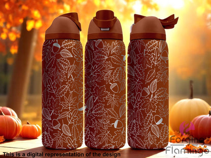 Three stainless steel tumblers with an autumn-themed design featuring an intricate pattern of leaves and acorns in a light engraved style over a warm brown background. The tumblers are set against a fall forest scene with orange foliage, pumpkins, and soft sunlight. Text at the bottom reads “This is a digital representation of the design.”
