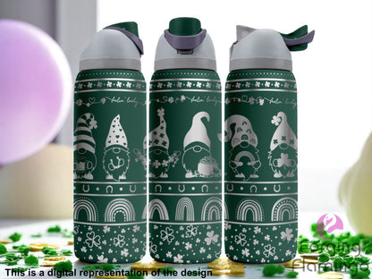 Three dark green stainless steel tumblers with a St. Patrick’s Day-themed laser-engraved design. Each tumbler features whimsical gnomes wearing festive hats, holding shamrocks, rainbows, mugs, or pots of gold. The cups are decorated with shamrocks, horseshoes, rainbows, and the phrase “feelin' lucky.” The background shows green and purple festive decorations with gold coins. Text at the bottom reads “This is a digital representation of the design.”
