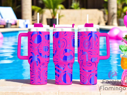 Three hot pink handled tumblers with straws, displayed poolside. The tumblers feature a playful summer-themed pattern in blue and purple tones, including images of beach balls, donuts, palm trees, citrus slices, inflatable unicorns, waves, and watermelon slices. The pool water in the background is bright turquoise with tropical plants and poolside lounge furniture visible. The Forging Flamingo logo is in the lower right corner, and text at the bottom reads “This is a digital representation of the design.”
