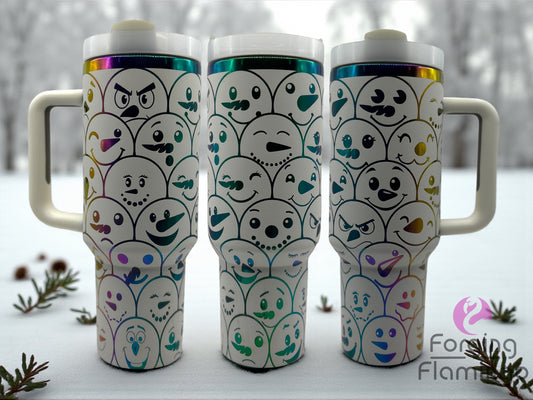 Three insulated travel mugs with ghost designs on a snowy background