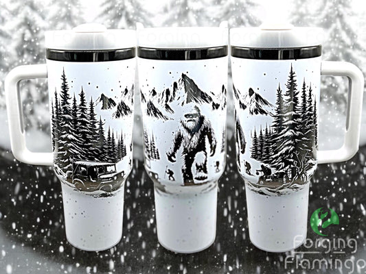 Composite image of a single tumbler engraved with Forging Flamingo's Abominable Snowman design, shown from multiple angles to highlight Bigfoot figures, snow-covered trees, and mountain scenery in a seamless winter wrap. Created using the digital file for 20oz/30oz/40oz tumblers.