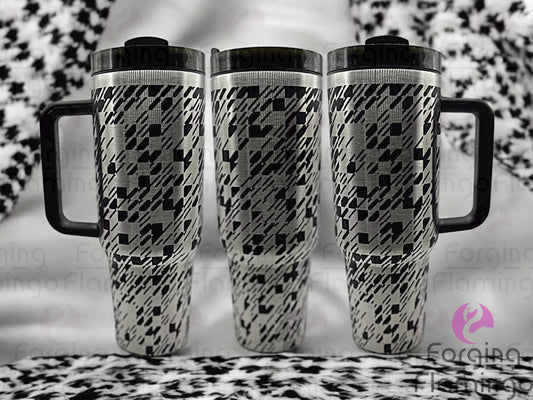 Composite image of a 40oz black tumbler with stainless engraving, featuring Forging Flamingo's Abstract Houndstooth design. Displayed from multiple angles to showcase a modern twist on the classic houndstooth pattern in a seamless, edgy wrap. Part of our Bargain Bin collection.