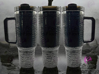 Composite image of a 40oz black tumbler with onyx engraving, featuring Forging Flamingo's Alligator/Crocodile Skin design. Shown from multiple angles to highlight bold, textured reptile scale patterns in a seamless, rugged wrap. Part of our Bargain Bin collection.