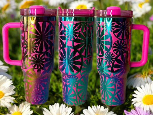 Composite image of a 40oz barbie pink tumbler with rainbow engraving, featuring Forging Flamingo's Retro Daisy design. Shown from multiple angles to showcase bold daisy patterns and vintage-inspired floral accents in a seamless wrap. Part of our Bargain Bin collection.