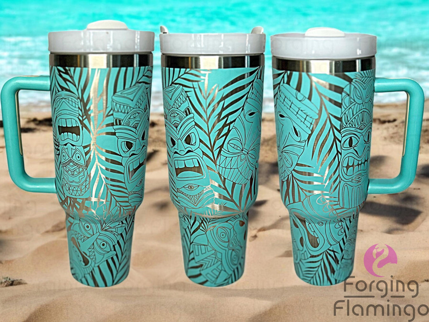Composite image of a 40oz teal tumbler with stainless engraving, featuring Forging Flamingo's Tiki design. Shown from multiple angles to highlight tropical tiki masks, palm fronds, and island-inspired patterns in a seamless wrap. Part of our Bargain Bin collection.