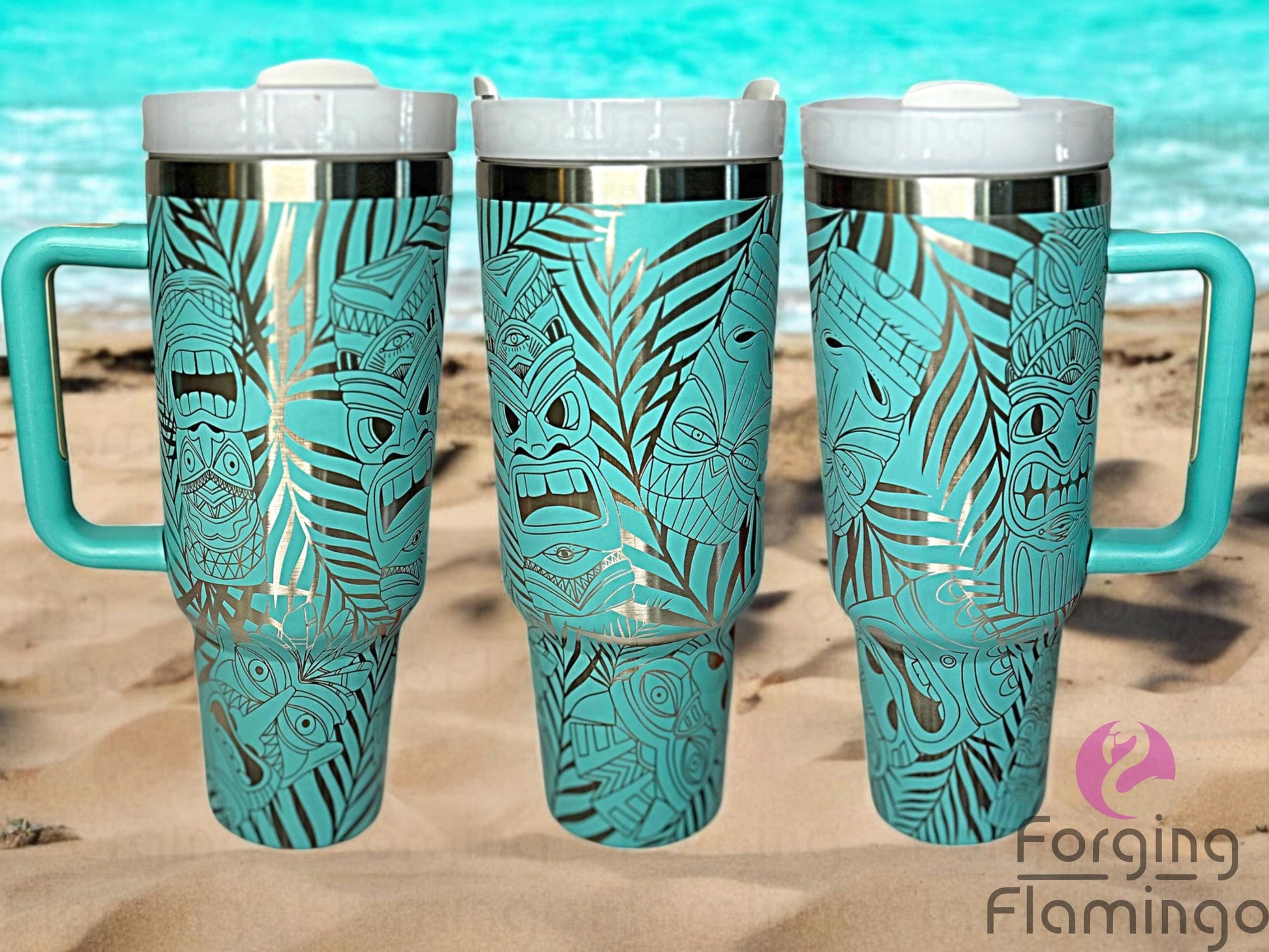 Composite image of a 40oz teal tumbler with stainless engraving, featuring Forging Flamingo's Tiki design. Shown from multiple angles to highlight tropical tiki masks, palm fronds, and island-inspired patterns in a seamless wrap. Part of our Bargain Bin collection.