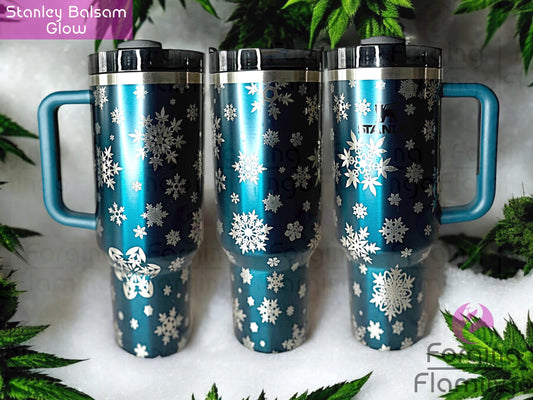 Composite image of a single Non-Branded balsam glow tumbler engraved with Forging Flamingo's Cannabis Snowflakes design, displayed from multiple angles to showcase snowflake patterns made from cannabis leaves in a seamless holiday-themed wrap.