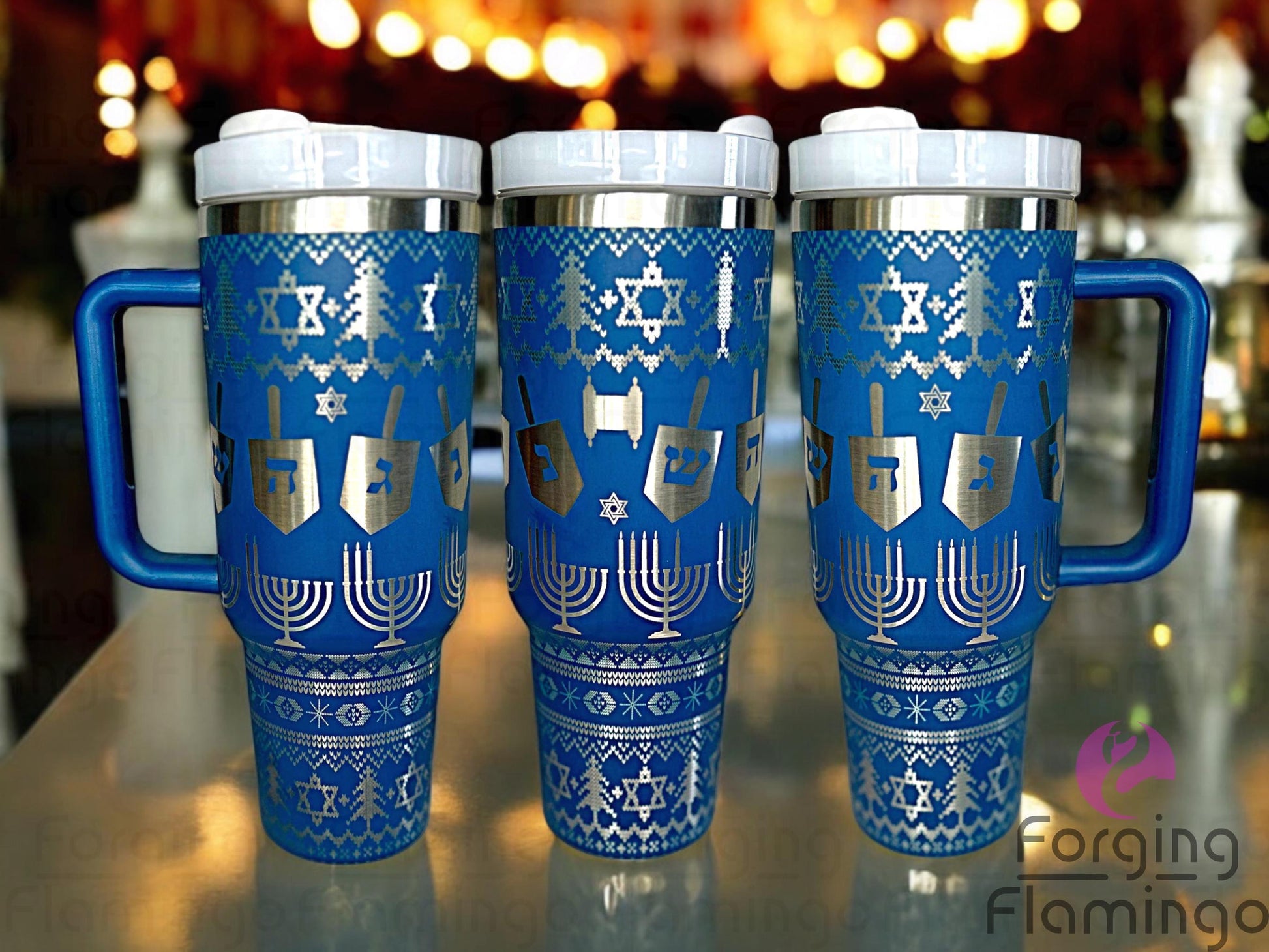 Composite image of a tumbler engraved with Forging Flamingo's Chanukah Sweater design, shown from multiple angles to highlight menorahs, dreidels, Stars of David, and festive sweater-inspired motifs in a seamless wrap. Created using the digital file for 20oz/30oz/40oz tumblers.