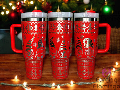 Composite image of a red tumbler engraved with Forging Flamingo's Christmas Gnomes design on a stainless base, shown from multiple angles to highlight festive gnomes in winter hats, snowflakes, and holiday accents in a seamless wrap.