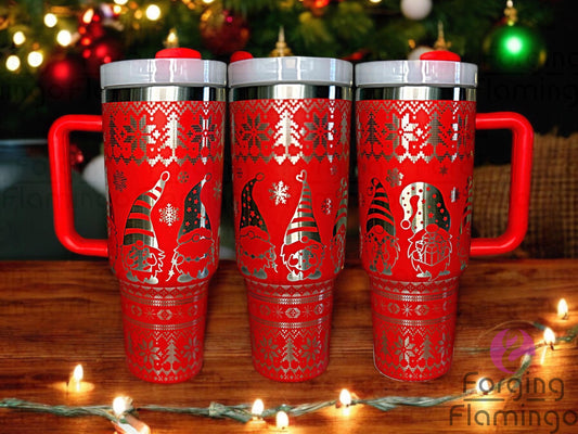 Composite image of a red tumbler engraved with Forging Flamingo's Christmas Gnomes design on a stainless base, shown from multiple angles to highlight festive gnomes in winter hats, snowflakes, and holiday accents in a seamless wrap.