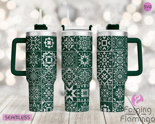 Mockup image of the Christmas Quilt Tumbler Wrap SVG by Forging Flamingo, displayed on three tumblers featuring holiday quilt block patterns with stars, trees, and festive stitching details in a seamless wrap. Digital design shown for 20oz, 30oz, and 40oz tumblers.