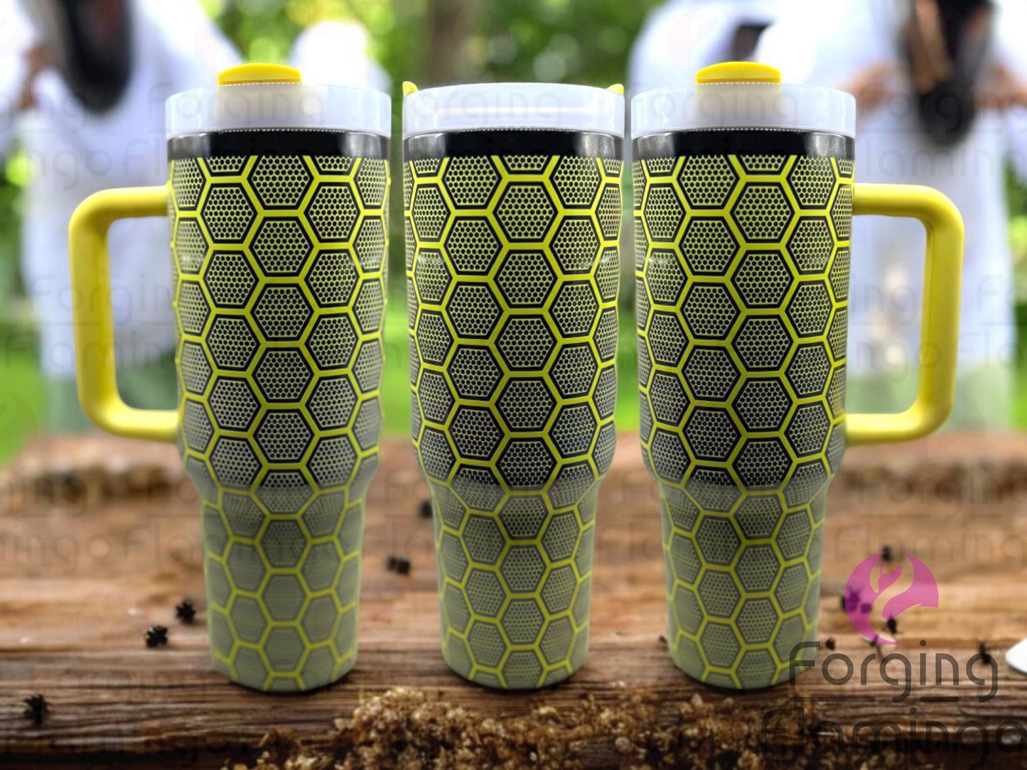 Composite image of a single Non-Branded tumbler engraved with Forging Flamingo's Beehive design, shown from multiple angles to showcase honeycomb patterns, buzzing bees, and floral accents in a seamless, nature-inspired wrap.