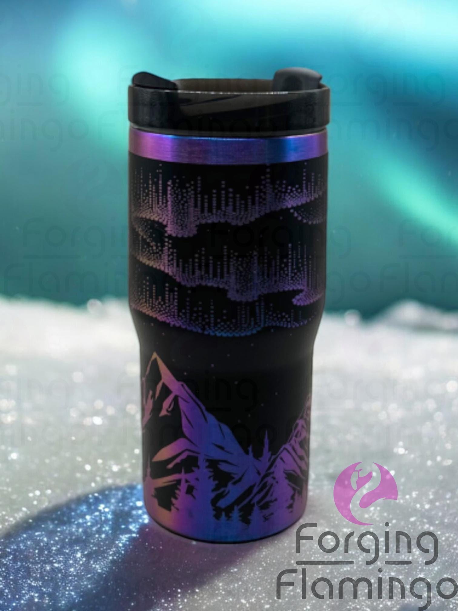 Single image of a 20oz Non-Branded black tumbler with a chroma rainbow base, engraved with Forging Flamingo's Northern Lights with Mountains design, showcasing vibrant aurora engraving above mountain silhouettes in a compact seamless wrap.