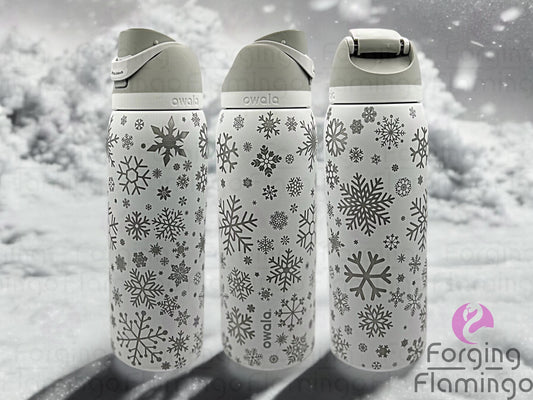 Composite image of a single Owala tumbler with a shy marshmallow base, engraved with Forging Flamingo's Snowflakes design, shown from multiple angles to highlight delicate snowflakes in a seamless winter-themed wrap.