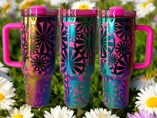 Composite image of a single tumbler engraved with Forging Flamingo's Retro Daisy design, shown from multiple angles to highlight large floral motifs and playful daisy shapes in a seamless wrap. Created using the digital file for 20oz/30oz/40oz tumblers.
