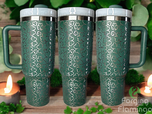 Composite image of a single tumbler engraved with Forging Flamingo's Shamrocks/Clovers design, shown from multiple angles to highlight lucky clover engravings in varied sizes across a festive, seamless wrap. Created using the digital file for 20oz/30oz/40oz tumblers.