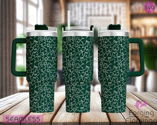 Mockup image of the Shamrocks/Clovers Tumbler Wrap SVG by Forging Flamingo, displayed on three tumblers featuring a mix of three- and four-leaf clovers arranged in a scattered, seamless St. Patrick's Day wrap. Digital design shown for 20oz, 30oz, and 40oz tumblers.