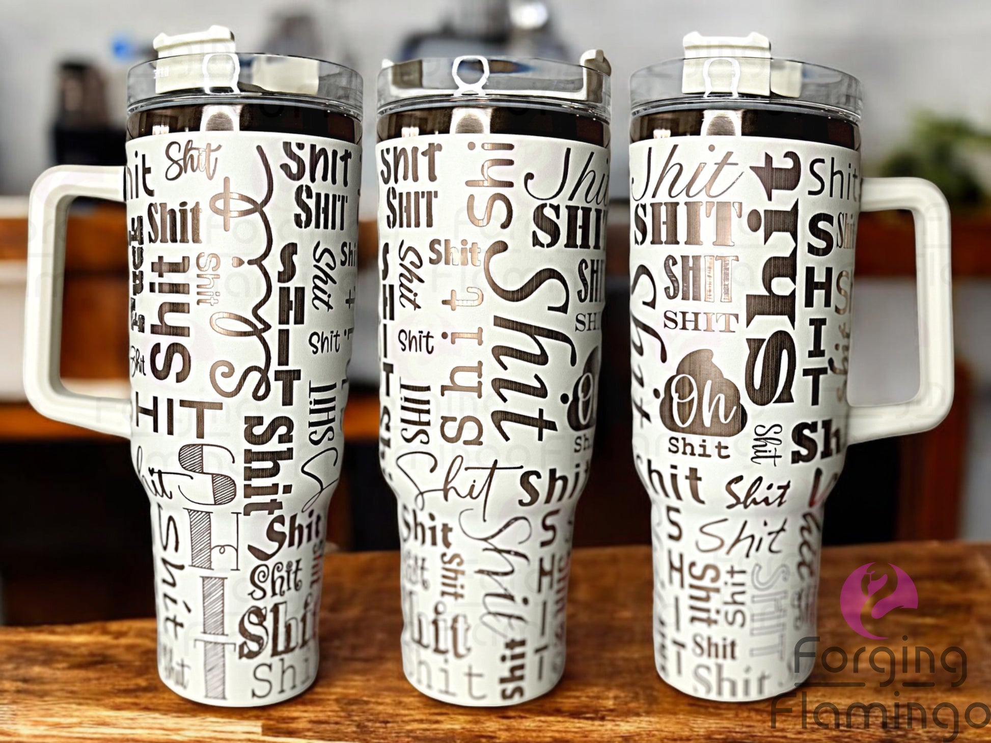 Composite image of a single Non-Branded tumbler engraved with Forging Flamingo's Sh!t Cup design in cream and gold, shown from multiple angles to highlight playful, bold typography in a seamless wrap.