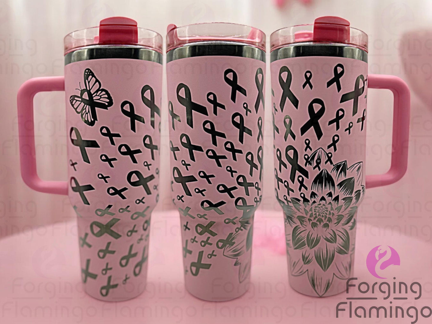 Composite image of a light pink Stanley tumbler with an onyx base engraved with Forging Flamingo's Dahlia Pink Ribbon design, shown from multiple angles to showcase outlined breast cancer awareness ribbons and delicate floral accents in a seamless wrap.