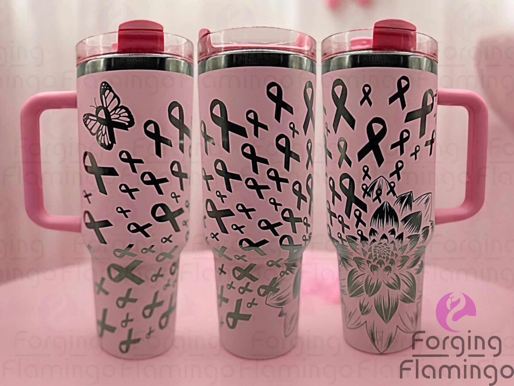 Composite image of a light pink Stanley tumbler with an onyx base engraved with Forging Flamingo's Dahlia Pink Ribbon design, shown from multiple angles to showcase outlined breast cancer awareness ribbons and delicate floral accents in a seamless wrap.