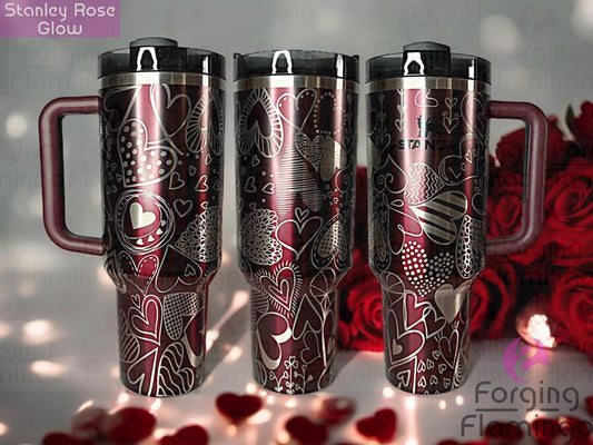 Composite image of a rosewood glow Stanley tumbler engraved with Forging Flamingo's Heart Doodles design, shown from multiple angles to highlight whimsical heart sketches wrapping seamlessly around the cup.
