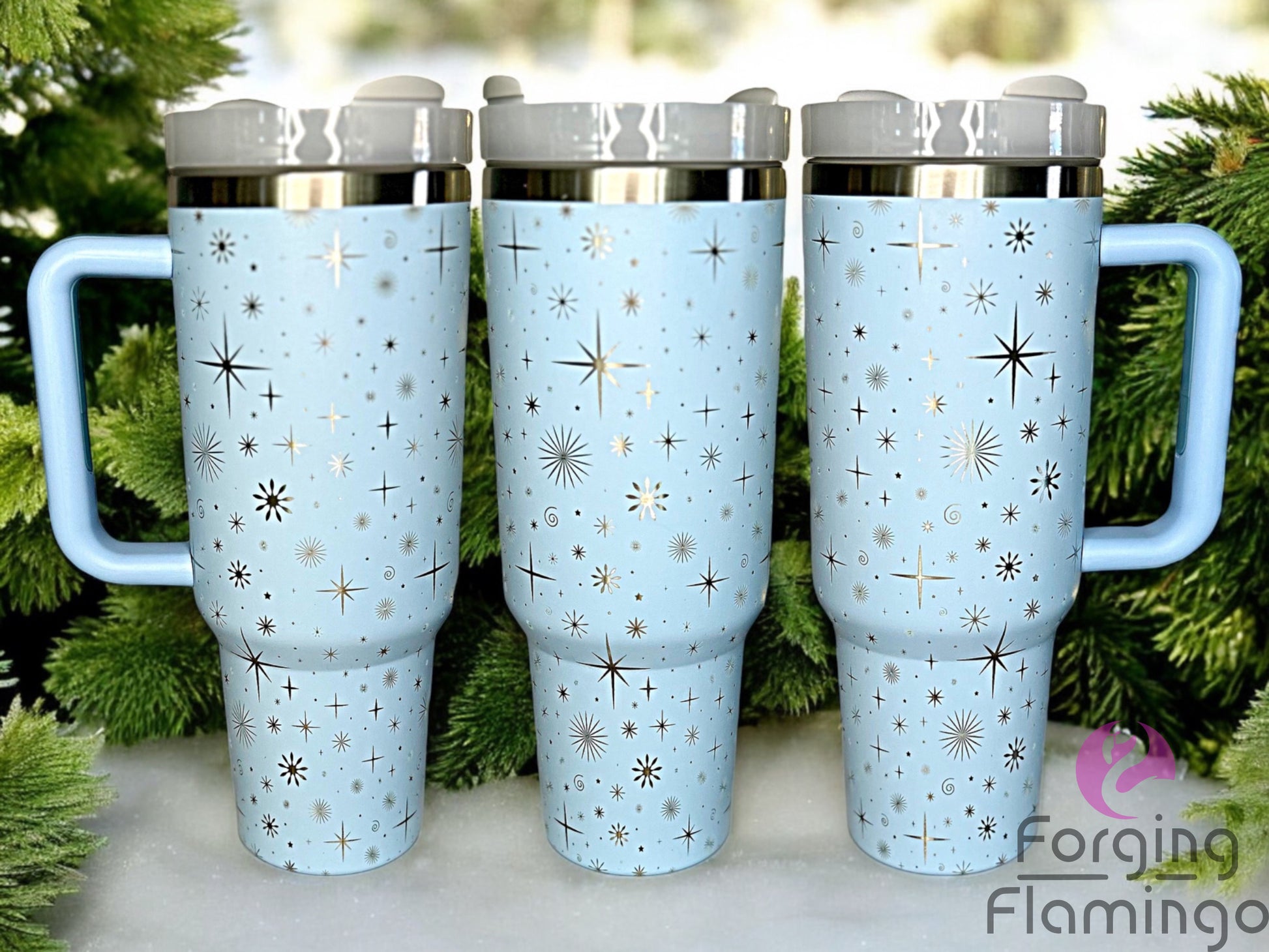 Composite image of a single tumbler engraved with Forging Flamingo's Stars & Snowflakes design, shown from multiple angles to highlight engraved starbursts and icy flake motifs in a seamless holiday wrap. Created using the digital file for 20oz/30oz/40oz tumblers.